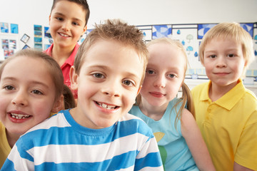 Group Of Primary Schoolchildren In Classroom