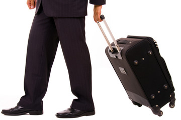 Detail of a businessman with suitcase at the airport