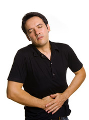 A man suffering from stomach pain, isolated on white