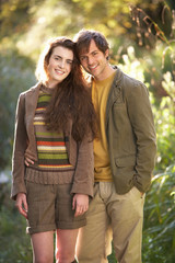 Fototapeta premium Portrait Of Romantic Young Couple In Autumn Landscape