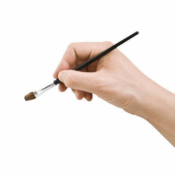 Hand holding brush isolated on white