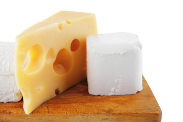 cheeses on wooden board