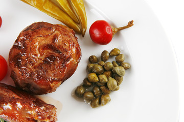 grilled meat medallion with cherry tomatoes