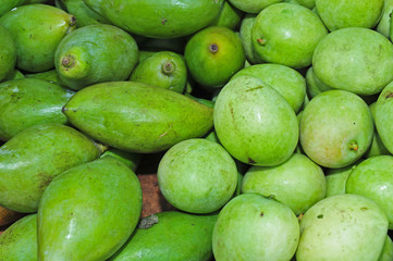 green mangoes in the markets