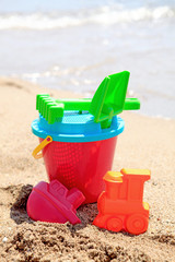 Fototapeta na wymiar colorful plastic toys at the beach