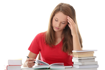 Teenage girl studying at the desk