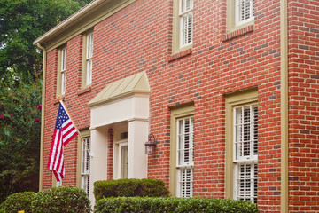 American Flag on Traditional Brick House