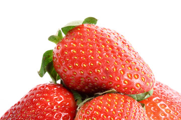 Few strawberries isolated on white