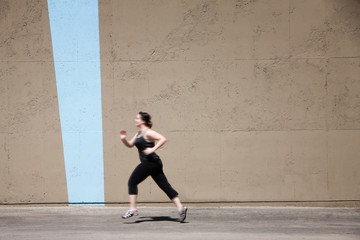 Single woman runs to get in shape