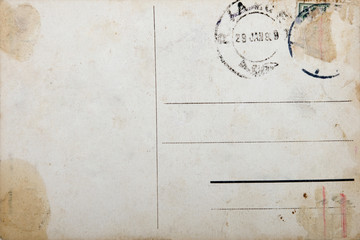 Old postcard, grunge paper with aging marks