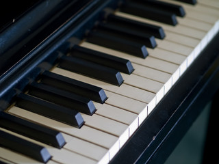 Piano keys of a very well loved and often played piano