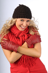 The attractive blond woman in the winter clothes