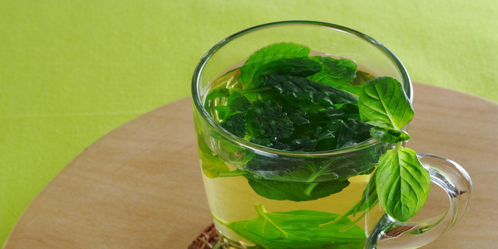 Fresh mint tea in glass cup with mint leaves (Selective Focus)