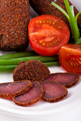 home made pressed meat with tomatos and onion