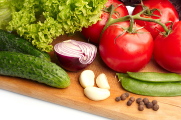 Fresh vegetables on wooden hardboard