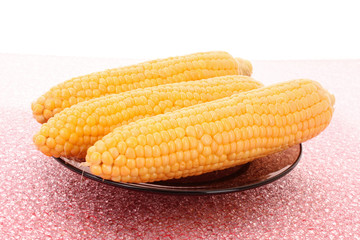 Tasty boiled yellow corn on the table