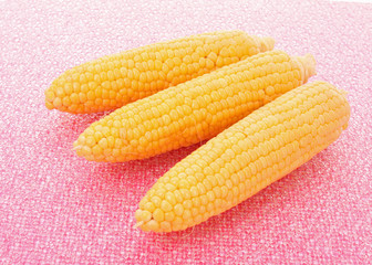 Tasty boiled yellow corn on the table
