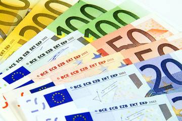 Euro banknotes isolated on a white background.