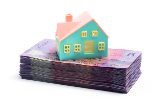 Stack of Notes with Miniature House