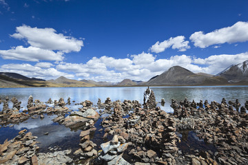 tibet: praying stones at lake si jin la cuo