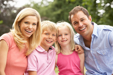 Obraz premium Portrait Of Family Relaxing In Countryside