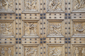 Wooden portal  of  St. Croce Church. Bastia Umbra. Umbria.