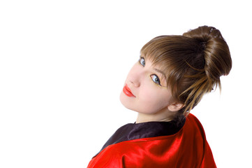 Portrait of a beautiful girl in kimono looking brom the back