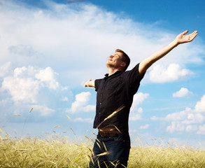 young man rest on wheat field