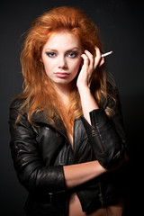 Fototapeta premium Portrait of beautiful young redhead woman