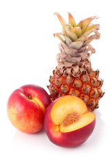 Fresh peach and pineapple fruits with cut isolated
