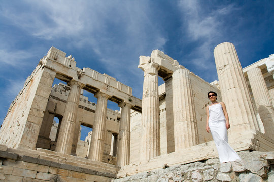 Woman Near Propylaea Columns Acropolis Athens Greece On Sky Back