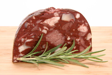 Traditional sausage: Headcheese with rosemary twig