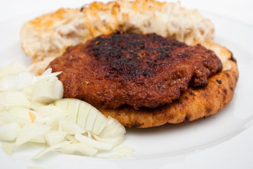 hamburger steak in flatbread (lepinja) with onion