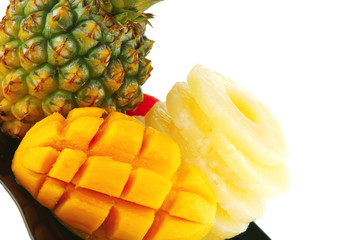 tropical fruits served on black