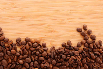 Coffee beans on brown background