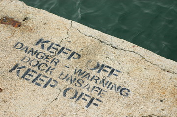 A Keep Off Warning Sign on an Unsafe Dock