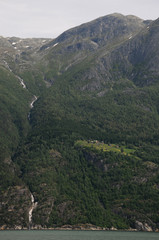 Fototapeta na wymiar Waterfall on Hardangerfjord, Norway