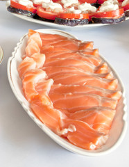 salted fish, sliced into a plate