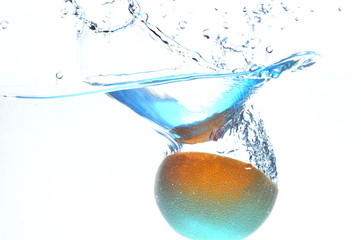 orange in streaming water