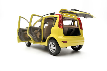 Generic modern yellow family car model on a white background