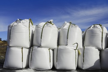 salt white sacks rows stacked to road ice