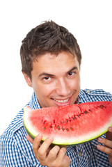 Young man holding water melon