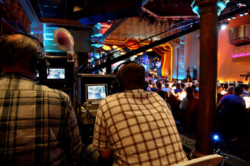 two video operators controlling camera at performance show