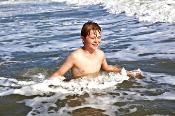 boys enjoying the beautiful ocean and beach