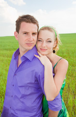 Young love Couple smiling under blue sky