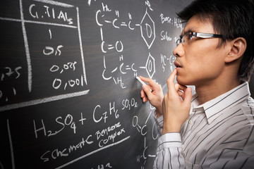 Male student working on equation