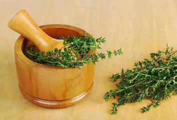 Fresh thyme with mortar and pestle (Selective Focus)