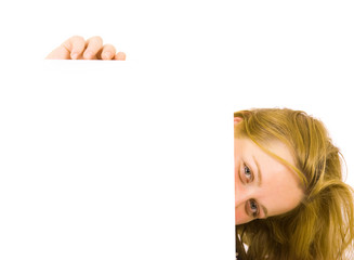 Portrait of a beautiful blond woman holding a blank billboard