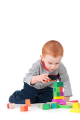 Boy building block tower
