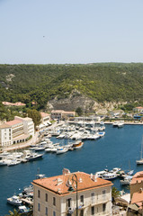 panorama Bonifacio Corsica harbor port with yachts historic lowe